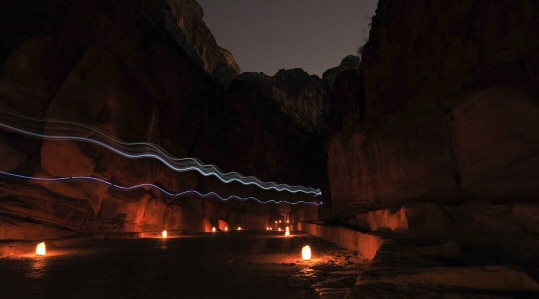 Anticipation builds on the one mile walk from the street to the site of the treasury building at Petra at night.