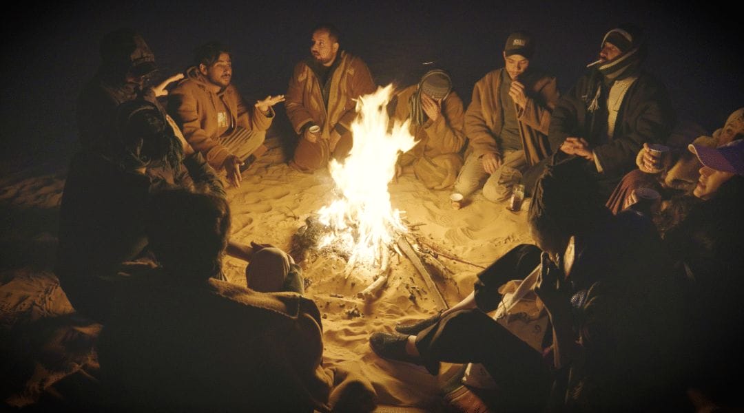 In the heart of the desert, ancient stories flicker to life, passed down through generations around the warmth of a shared fire. 